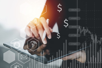 Close up of female hand pointing at abstract business projection. Bright interior in the background. User, technology and network concept.