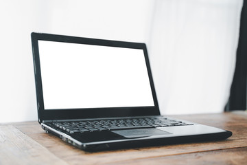 Notebook works on a wooden office desk in the office.