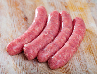 Raw farm sausages with rosemary