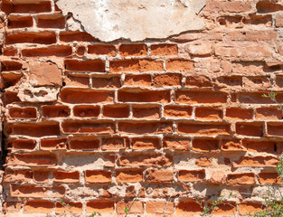 Brick wall weathered ruined bricks