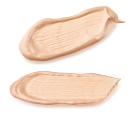 Liquid foundation cream swatch smear. Light beige makeup concealer stroke isolated on white background with clipping path included without shadows. Nude makeup base swipe