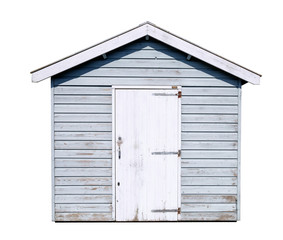 Frontal view of a simple off white garden shed, made from planks, with a door and a saddle roof,...