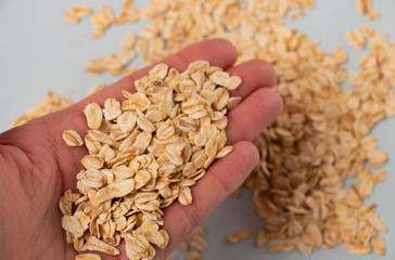 cereal oatmeal in the palm of a girl cook