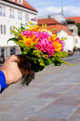Fototapeta premium bright bouquet in the hand