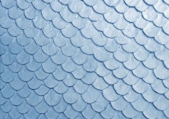 Blue color fish scale mortar plastering pattern on skin of wall vintage  © Arunee
