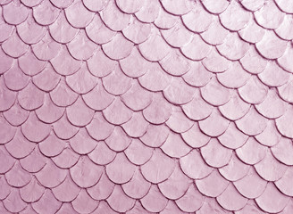 Pink color fish scale mortar plastering pattern on skin of wall vintage  © Arunee