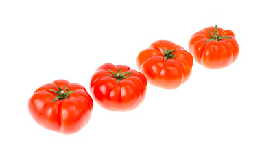 Red ripe juicy beeftomats isolated on white background