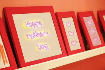 happy mother's day text on pink background with red frame.
