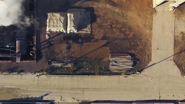Top down aerial view of rotary kiln at a cement plant. Summer sunny day
