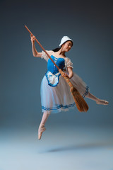 In flight. Young and graceful female ballet dancer as Cindrella fairytail character on studio background. Art, motion, action, flexibility, inspiration concept. Flexible ballerina in inspired dancing.