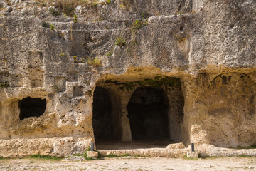 Italy  Sicily  Syracuse , 05 May 2019:  Archaeological Park of Neapolis, Necropolis near the Greek Theater