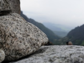 Close up of stone with mountains in the background