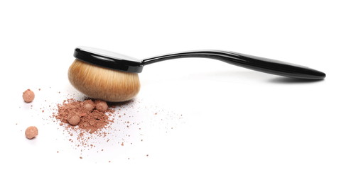 Face powder, makeup pile and applicator brush isolated on white background