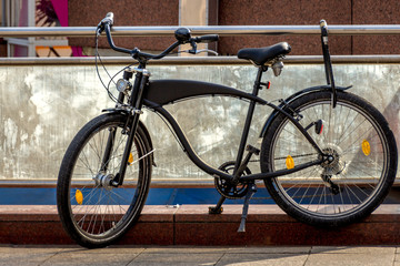 Fototapeta na wymiar A locked bicycle in the city