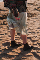 young woman walking on the beach