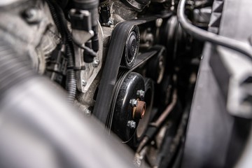 Fan belt and v-belt powering alternator, water pump and air conditioner compressor.