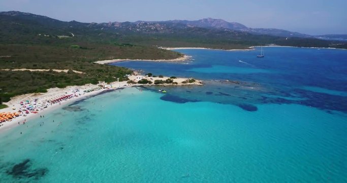 Amazing aerial view of a sunny summer day in Spiaggia Rena Bianca, Sardinia, Italy. 