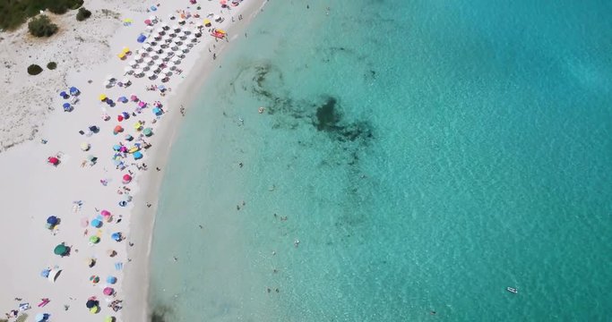 Amazing aerial view of a sunny summer day in Spiaggia Rena Bianca, Sardinia, Italy.