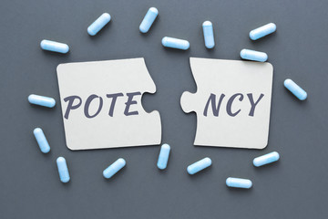 abstract photo of problems with potencies, two jigsaw puzzles with the words potency and pill...