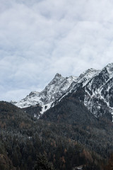 High mountains with fresh snow in sunny winter day. Top aerial view. Innsbruck ski resort panorama at sunset in winter time, Tirol. Austria, drone footage. Mountains concept.