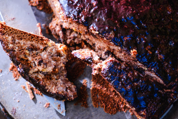Sliced chocolate cake on a plate.