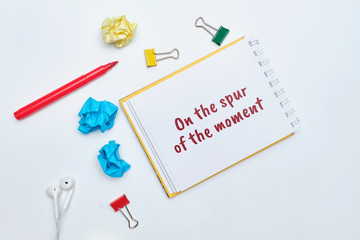 on the spur of the moment - english time idiom hand lettering on wooden blocks