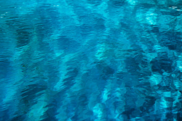 Fototapeta na wymiar Smimming pool surface texture, toned selective focus image