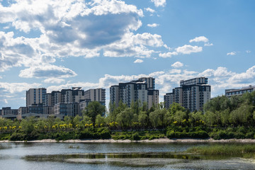 Fototapeta premium Residential area under blue sky and white clouds