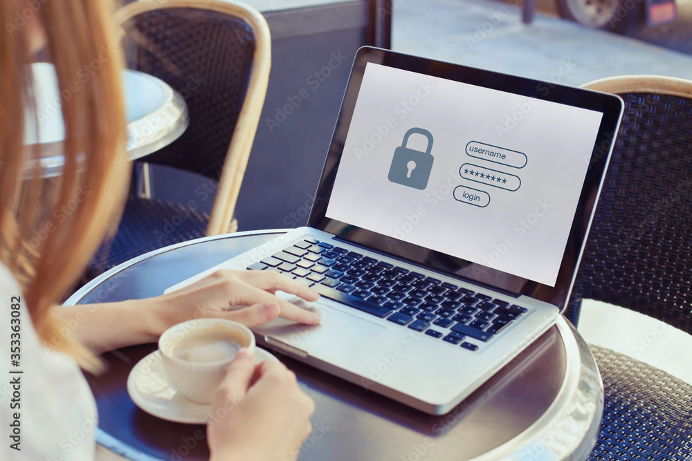 Wall mural data protection and internet security concept, woman user typing password on computer for secured ac
