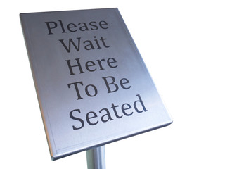 please wait here to be seated sign on white background