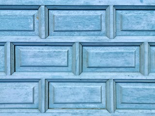 The texture of the old blue carved wooden windows, handmade crafts. Geometry rectangle.