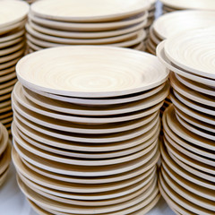 Wooden plates stacked on top of one another, close-up background