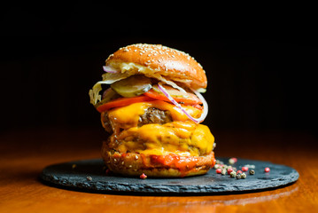 big burger on black plate