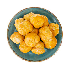 Sweet delicious crunchy homemade profiteroles. Studio Photo