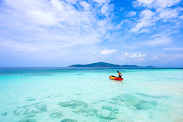 Fototapeta na wymiar Kayaking tourists In the beautiful sea