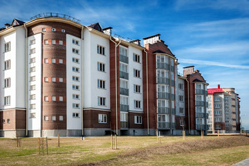 Obraz premium Residential buildings with balconies in the city, urban development of apartment houses.