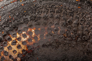 charred bottom of an old pan