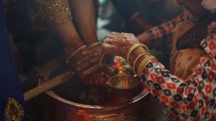 A ceremony of washing feet to the bride before her marriage by her female relatives, Nepali and...