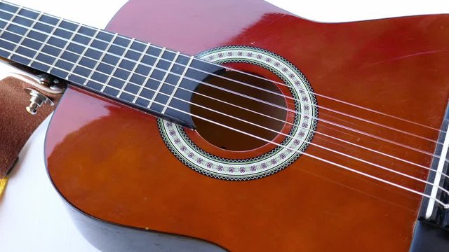 Acoustic guitar background and strings. Children's classic guitar. Soundboard and vulture.
