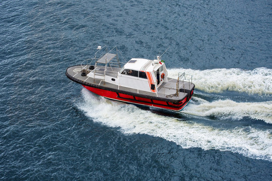 Rio de Janeiro. Brazil. Pilot boat in Guanabara Bay.
 Pilot boats are designed for fast and safe delivery of the crew or pilot to dangerous places. Guanabara is a Bay (often called a Bay) 