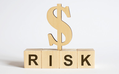 Text Risk on wood cube block, stock investment concept.