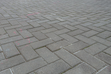 abstract background of an old tiles on the road in the park close up
