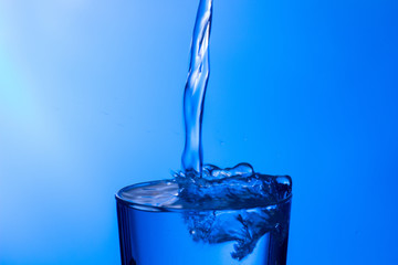 water falling into a clear glass