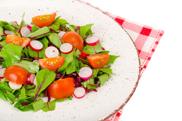 Healthy nutrition. light salad of beetroot leaves, radish and cherry tomatoes