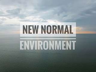 NEW NORMAL ENVIRONMENT text on sky background. Covid 19 and coronavirus concept
