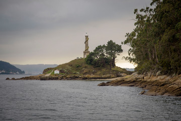 Views of the lighthouse of the Tambo island, from a boat, of the Ria de Pontevedra in Galicia,...