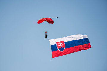 Slovak army parachutist flying from the sky with Slovak flag