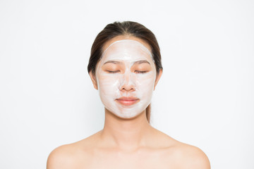 Young beautiful woman applying yogurt facial mask Skin care, beauty treatments on white background