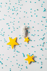 White seahorse and yellow stars, summer time minimal concept