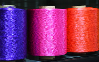 Polypropylene multifilament yarns. Three large colorful polypropylene thread set. Multicolor bobbin thread. Set of sewing thread coils, miscellaneous colours.